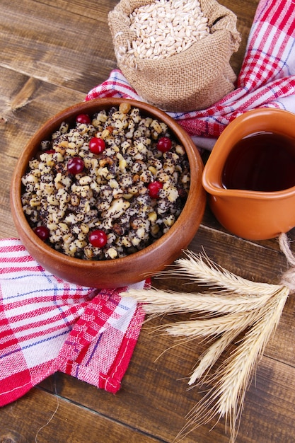 Plate with kutia -  traditional Christmas sweet meal in Ukraine, Belarus and Poland, on wooden background