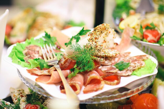 Plate with meat appetizer on the table in the restaurant