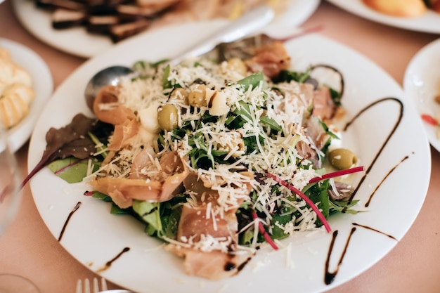 Plate with meat salad on a holiday table in a restaurant