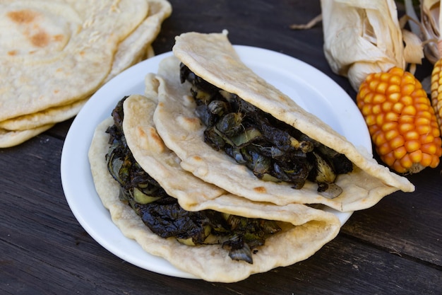 Plate with mexican tacos stuffed with huitlacoche