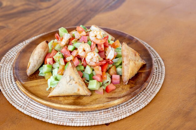 Plate with mixed shrimps salat.