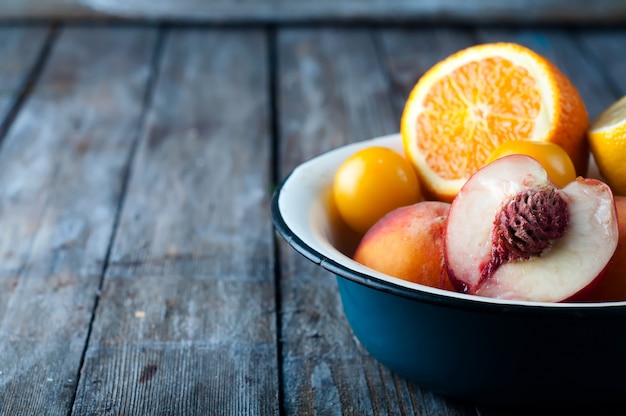 Plate with peach, lemon and orange