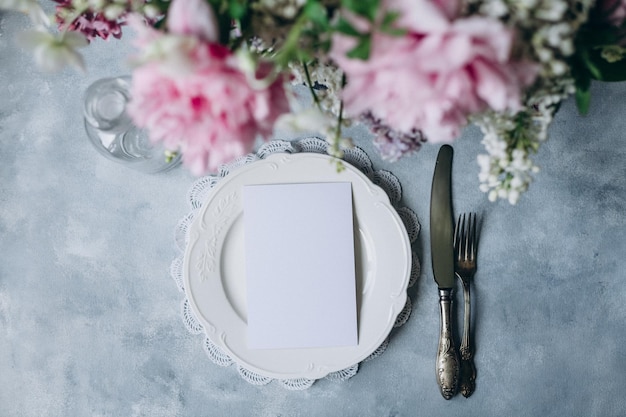 a plate with a piece of paper on it and a plate with a napkin on it