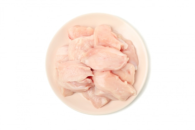 Plate with raw chicken meat isolated on white