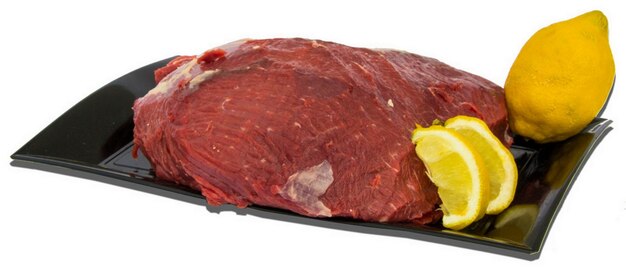 Plate with raw meat and food decorations around on a white background, Isolated Object