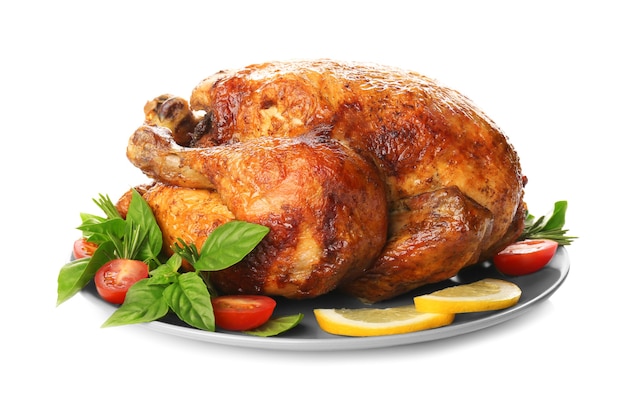 Plate with roasted turkey on white background