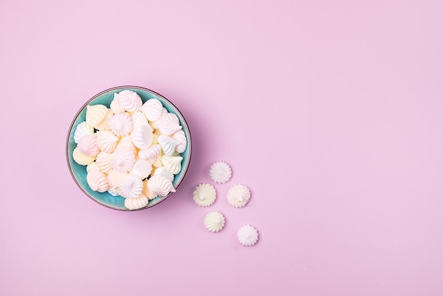 Plate with Small Meringues on Pink Background Tasty Dessert Horizontal Copy Space