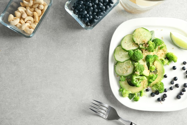 Plate with superfood salad on table