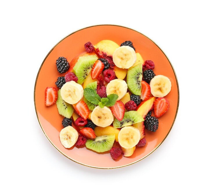 Photo plate with tasty fruit salad on white