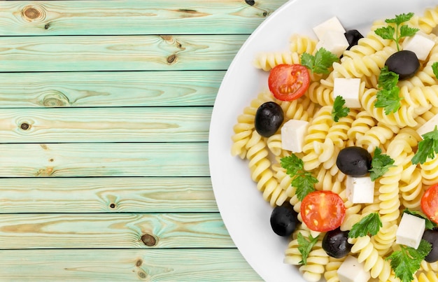 Plate with tasty italian pasta, top view