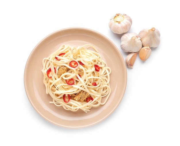Plate with tasty noodles, chicken and garlic isolated