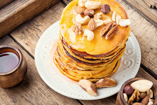 Plate with tasty pancakes