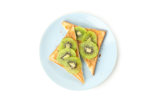 Plate with toasts with kiwi isolated on white background