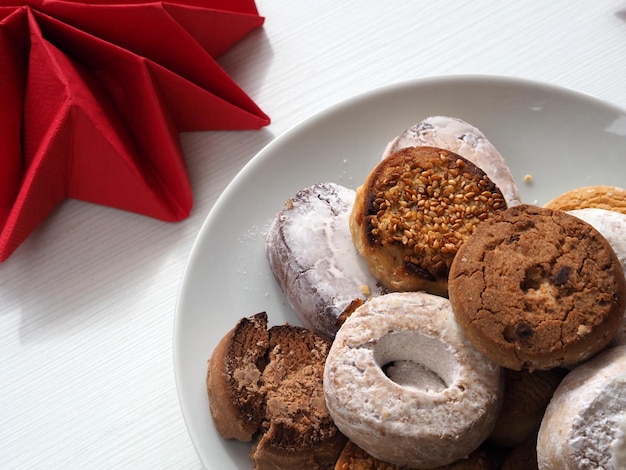 Plate with traditional Spanish sweets Polvorones y Mantecados