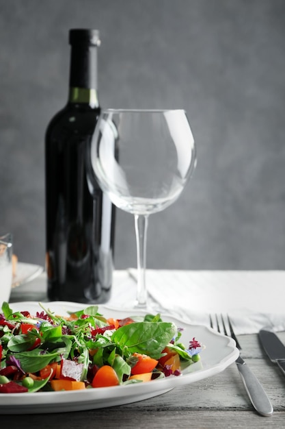 Plate with useful beet salad on table