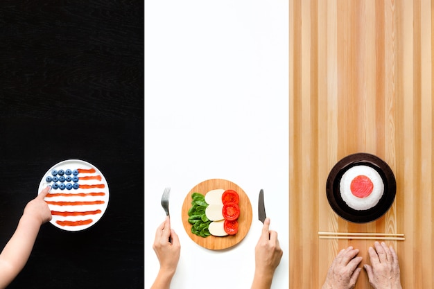 Plates of food in the form of flags of America, Italy and Japan.