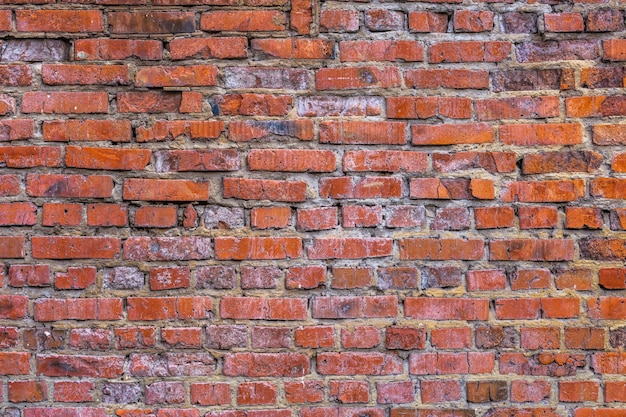 Platte bakstenen muur achtergrond en textuur met lichte tekenen van erosie