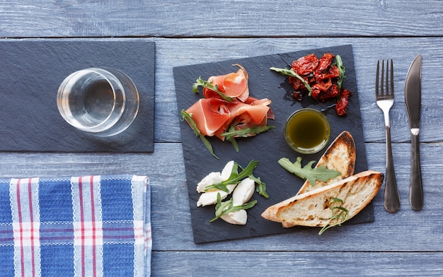 Platter antipasto with prosciutto and mozzarella