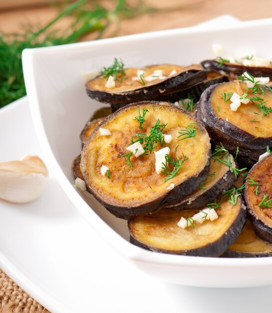 Platter of grilled eggplant with garlic and dill