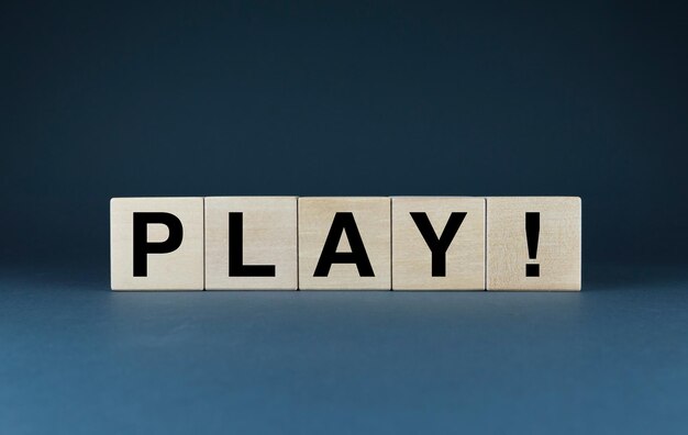 Photo play cubes form the word play the extensive concept of the word play