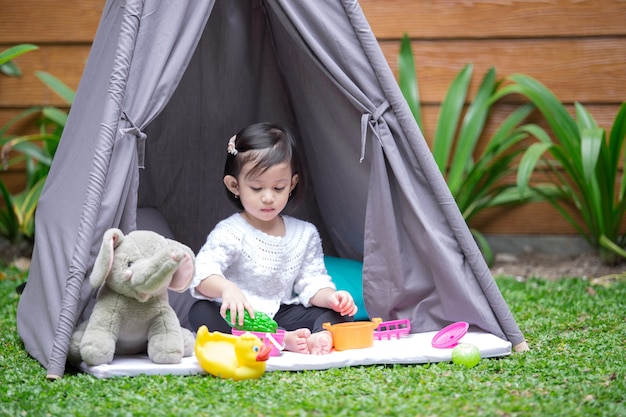 Play in tent at backyard