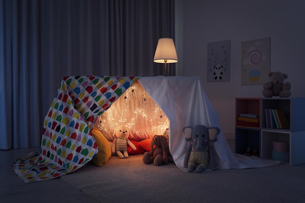 Play tent decorated with festive lights in modern child's room