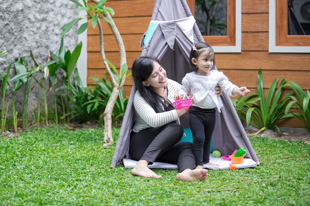 Photo play toys with mother in tent