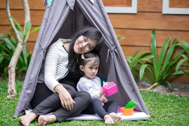 Play toys with mother in tent