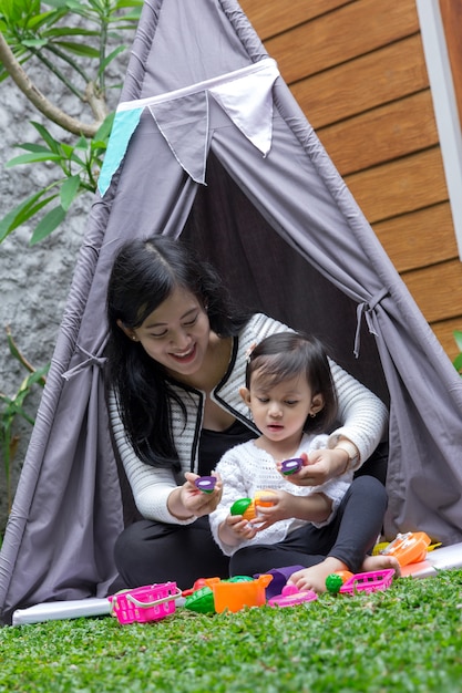 Photo play toys with mother in tent