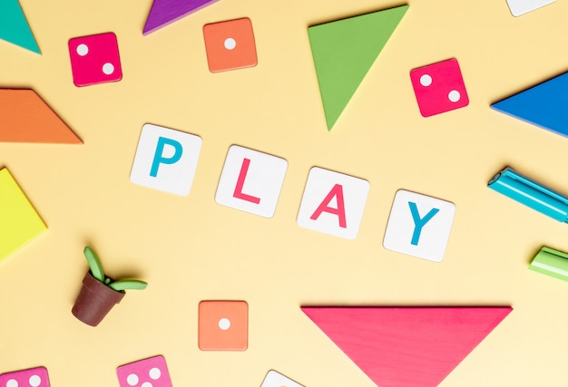 Play with toy and objects for child education concept on yellow