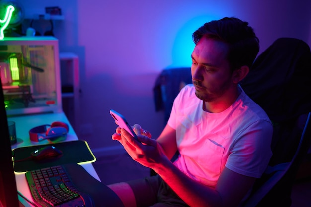 Player looking at his computer screen contemplating his next move in an online video game