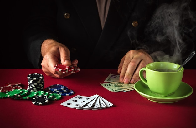 The player places a bet with chips on playing cards with a winning straight flush combination