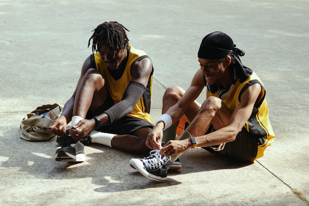 Players tying shoe laces