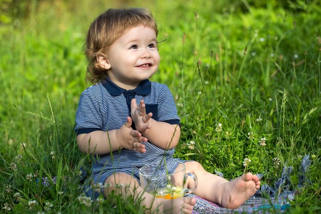 Playful baby boy on grass