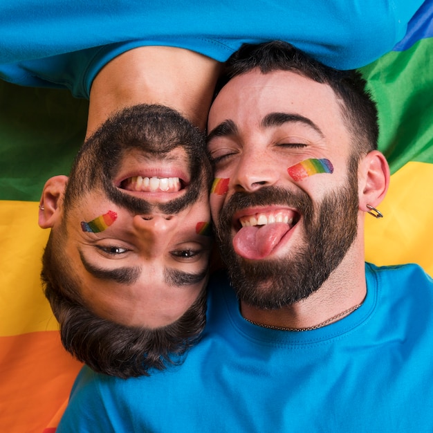 Playful gay couple smiling
