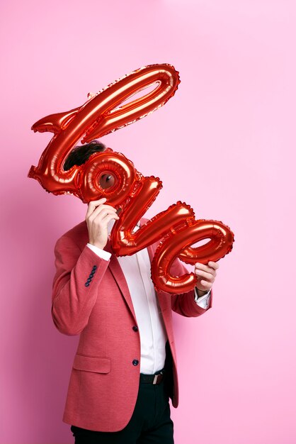 Photo playful man having a fun while valentine's day