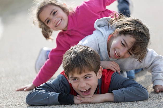 Playful siblings on road