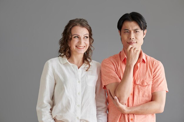 Playful Woman Looking at Confused Man