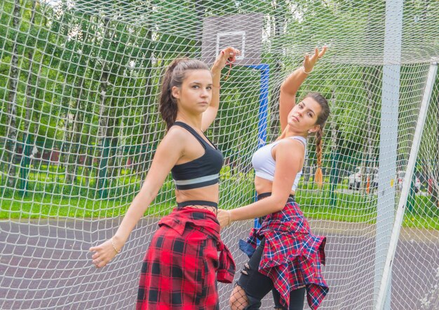 On the Playground posing beautiful girls at the football grid.