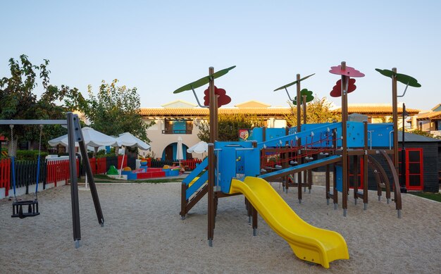 Playground with slide and swing at dawn