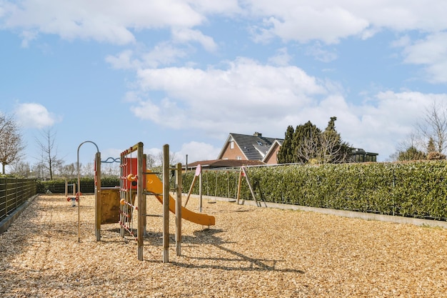 A playground with a swing set in a park