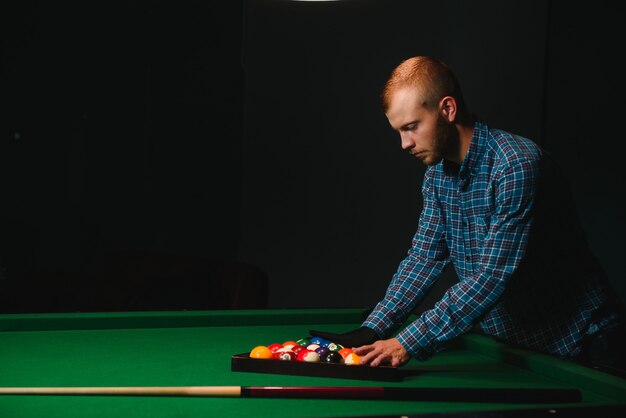 Playing billiard - Close-up shot of a man playing billiard