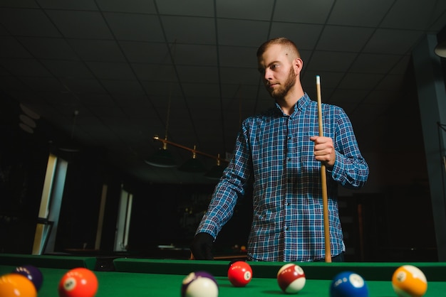 Playing billiard - Close-up shot of a man playing billiard