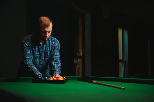 Playing billiard - Close-up shot of a man playing billiard