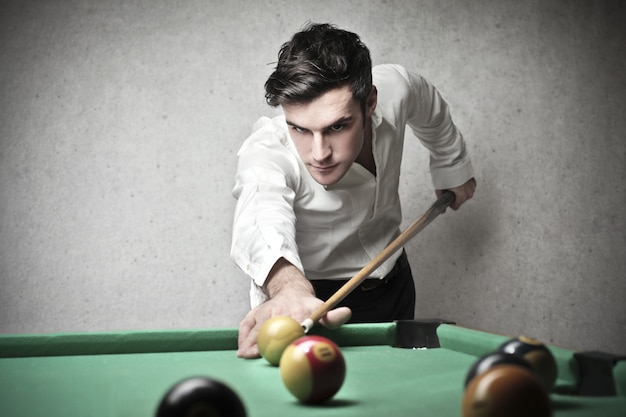 Photo playing billiards by fun