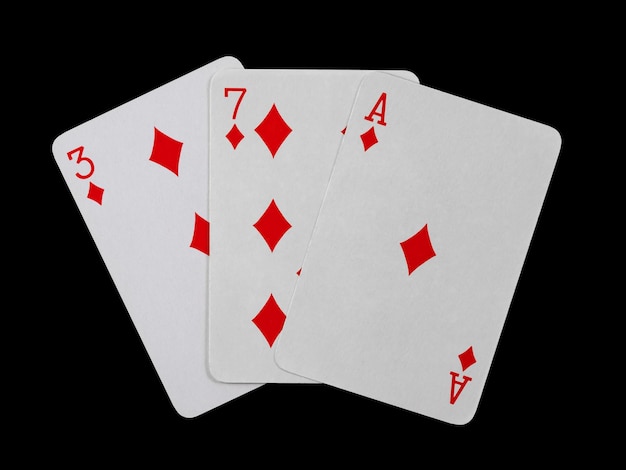 Playing cards 3 7 and ace are fanned out isolated on a black
background