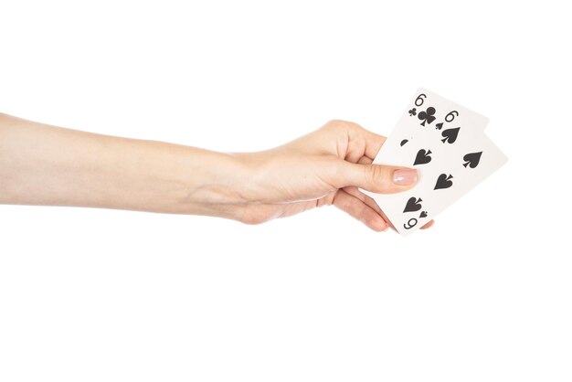 Playing cards in hand isolated on white background