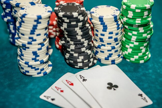 Playing cards with colorful poker chips close up