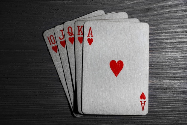 Playing cards on wooden table top view