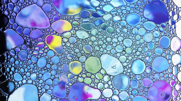 Playing colors in water oil soap bubbles mixed texture